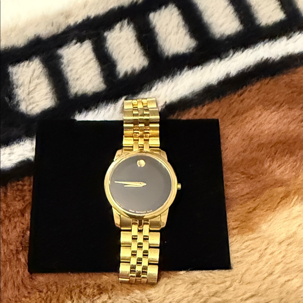 Movado Gold Watch with Dark Dial